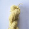 Skein of yellow yarn on a white background