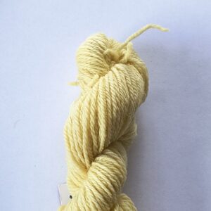 Skein of yellow yarn on a white background