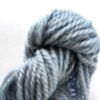 Sky blue skein of wool on a white background