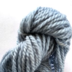 Sky blue skein of wool on a white background